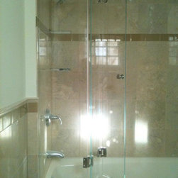 Bi fold frameless door for tub - Shower Doors