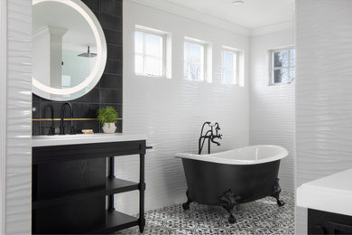Large master white tile and porcelain tile porcelain tile, black floor and single-sink bathroom photo in Newark with black cabinets, a one-piece toilet, white walls, an integrated sink, quartzite countertops, a hinged shower door, white countertops and a freestanding vanity