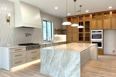 Inspiration for a huge contemporary laminate floor and beige floor eat-in kitchen remodel in Dallas with a single-bowl sink, shaker cabinets, beige cabinets, quartzite countertops, beige backsplash, ceramic backsplash, stainless steel appliances, an island and beige countertops