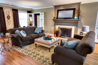 Mid-sized elegant formal and enclosed light wood floor and brown floor living room photo in Wichita with beige walls, a standard fireplace, a tile fireplace and no tv