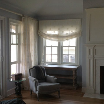 After Photo - Luxurious Drapes and Sweeping Relaxed Roman Shades