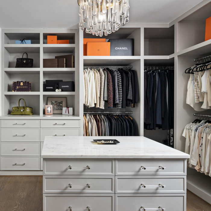 Her closet is an intimate space that reflects the style and sophistication of our client. With plenty of drawer storage, this wrap around closet has ample space for shoes and clothes alike. A window p