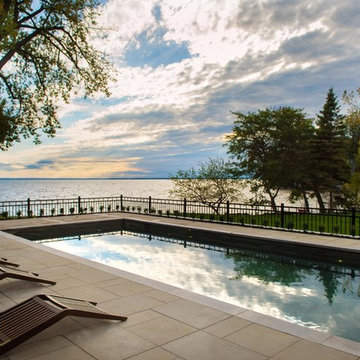 Contemporary pool and backyard in Pointe-Claire