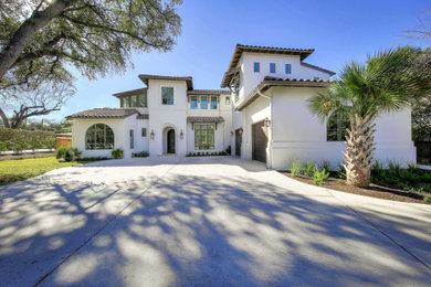 Large tuscan house exterior photo in Other with a tile roof