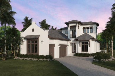 Photo of a transitional two-storey stucco white house exterior in Miami with a hip roof and a tile roof.