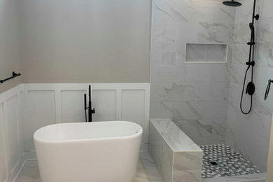 Example of a trendy ceramic tile and multicolored floor bathroom design in Atlanta with gray walls and a niche