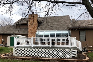 Example of a large classic backyard deck design in Other with no cover