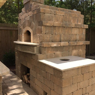 Pizza oven with outdoor kitchen, fire pit and pool deck