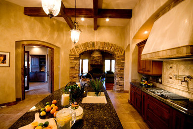 Example of a tuscan kitchen design in Albuquerque