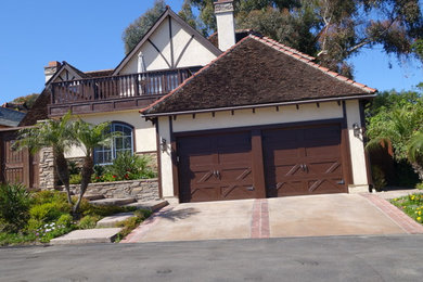 Large southwestern beige two-story stucco exterior home idea in San Diego
