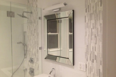 Example of a mid-sized minimalist kids' gray tile and mosaic tile mosaic tile floor bathroom design in New York with an undermount sink, marble countertops, a one-piece toilet and white walls