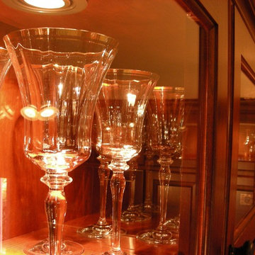 Rich colored cherry cabinets with glass accents
