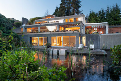 Inspiration for a modern gray three-story concrete exterior home remodel in Vancouver