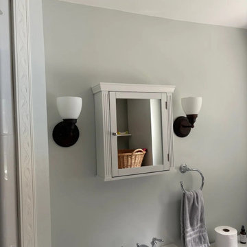 Symmetric bathroom sconces placed for even, flattering light
