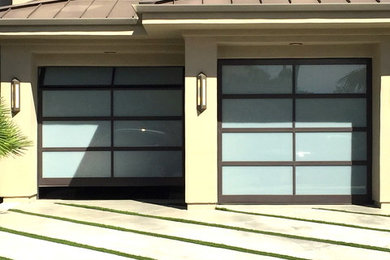 Example of a huge beige three-story stucco exterior home design in Orange County
