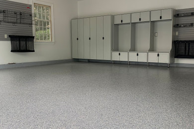 Inspiration for a mid-sized timeless attached two-car garage remodel in New York