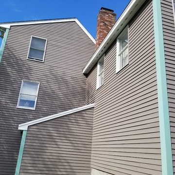 Painting a house in Beverly