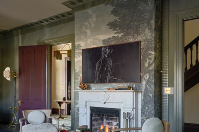 Example of a mid-sized trendy open concept dark wood floor, brown floor and wallpaper living room design in Cincinnati with green walls and a standard fireplace