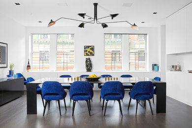 Inspiration for a large contemporary medium tone wood floor great room remodel in New York with white walls