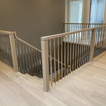 White Oak Stairs with Polished Stainless Steel Balusters