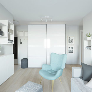 Inspiration for a small scandi open plan living room in Other with grey walls, laminate floors, a wall mounted tv and pink floors.