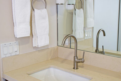 Inspiration for a mid-sized contemporary master beige tile bathroom remodel in Los Angeles with flat-panel cabinets, medium tone wood cabinets, quartz countertops, an undermount sink and beige walls