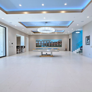 Large contemporary walk-out basement in Orange County with grey walls, limestone flooring, no fireplace and white floors.