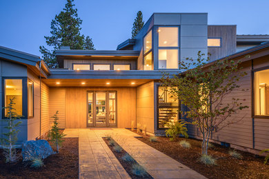 Contemporary wood exterior home idea in Other