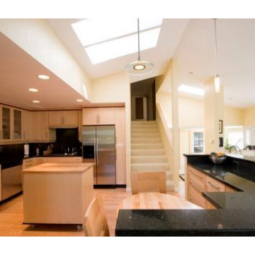 An open kitchen floor plan gaining all of its natural light from above