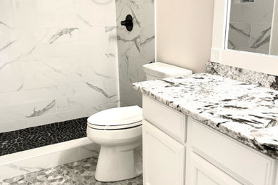Inspiration for a small transitional mosaic tile floor bathroom remodel in Austin with quartz countertops