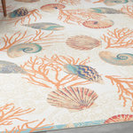 Nourison - Waverly Sun N' Shade All-over design Ivory/Multi 7'9" x 10'10" Area Rug - In an artistic fusion of global-inspired and contemporary design, the Shore Thing coastal outdoor rug from the Waverly Sun N' Shade Collection presents a scattering of brilliantly detailed undersea motifs over a floral mandala pattern. A multicolored palette of blue, red, and orange is surrounded by a teal blue border that brings definition to any indoor or outdoor seating arrangement you choose. Machine made of polyester in a low-profile design that you can easily place in high traffic areas such as the living room or dining room, or onto your patio, porch or deck.