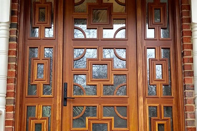 Eclectic front door in Other with a medium wood front door.