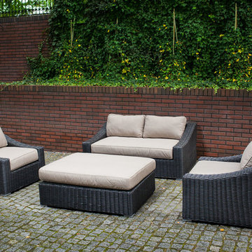 Toja Patio Furniture - Tuscan Love Seat Set - Red Brick Wall