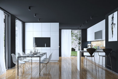 Example of a mid-sized minimalist l-shaped light wood floor and beige floor eat-in kitchen design with an undermount sink, flat-panel cabinets, white cabinets, quartzite countertops, beige backsplash, matchstick tile backsplash, stainless steel appliances and a peninsula