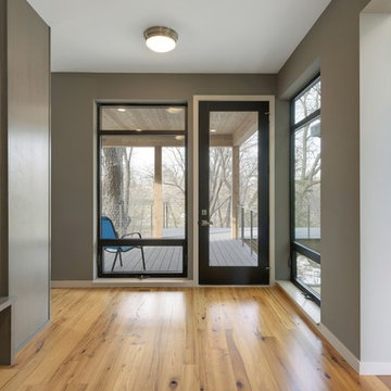 Antique Elm Flooring in a Modern Mudroom