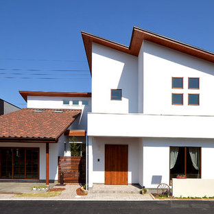 他の地域の地中海スタイルのおしゃれな白い家 (片流れ屋根) の写真