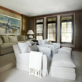 Home theater - huge contemporary enclosed carpeted home theater idea in Tampa with brown walls and a media wall