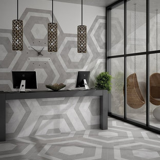 Photo of an expansive modern study in Orange County with white walls, porcelain flooring, no fireplace and a freestanding desk.