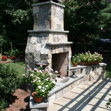 Flagstone patio with fireplace and pergola - Oak Hill, VA
