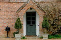 Color Suggestions Needed for Garage and Doors on Orange Brick House