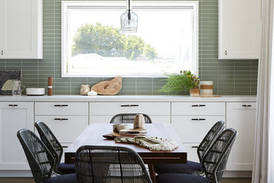 Kitchen/dining room combo - small transitional medium tone wood floor and brown floor kitchen/dining room combo idea in San Francisco with beige walls and no fireplace