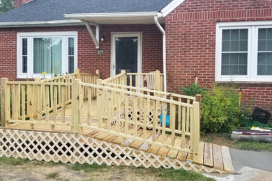 Mid-sized elegant porch photo in Other with decking and a roof extension