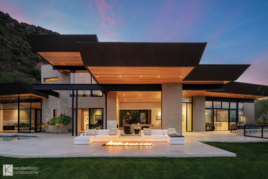 Inspiration for a contemporary front yard patio in Phoenix with a fire feature, concrete slab and a roof extension.