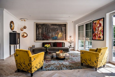 Example of a mid-sized eclectic formal and enclosed light wood floor and brown floor living room design in San Diego with gray walls, no fireplace and no tv