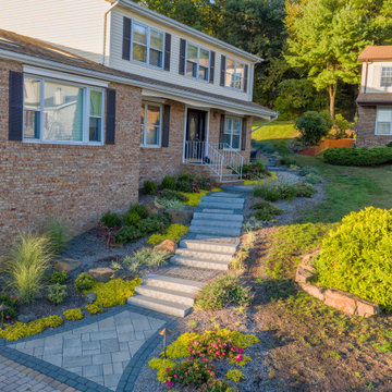 Dual patio with adjoining firepit feature