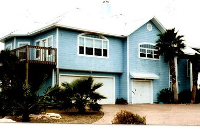Example of a beach style home design design in Austin