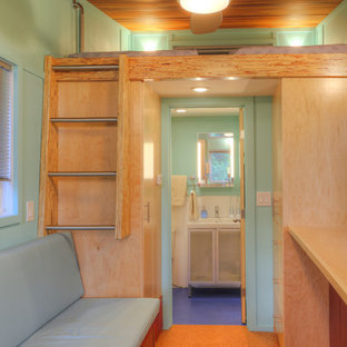 Small minimalist loft-style cork floor bedroom photo in New York with blue walls and no fireplace