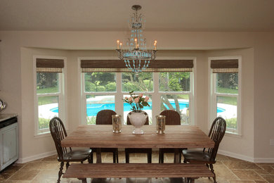 Example of a country dining room design in Jacksonville with beige walls