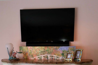 Example of a mid-sized classic family room design in Miami with a concealed tv