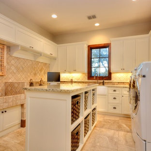 Rustic u-shaped utility room in Austin with a belfast sink, flat-panel cabinets, white cabinets, granite worktops and a side by side washer and dryer.